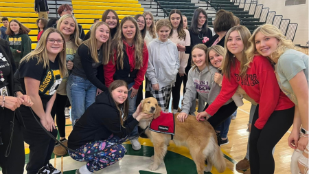 Tora with students and staff of Elkins High School