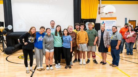 Tora with students and staff of Elkins High School