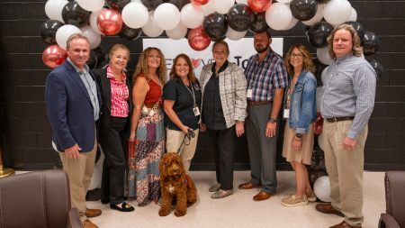 Tora with students and staff of Elkins High School