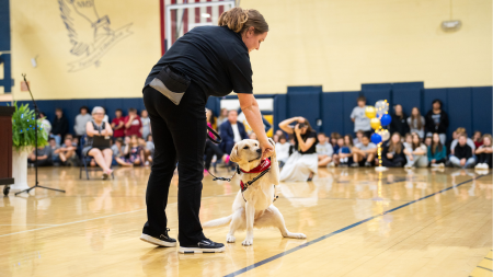 Tora with students and staff of Elkins High School