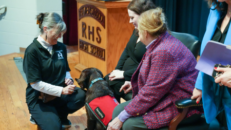 Tora with students and staff of Elkins High School