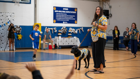 Tora with students and staff of Elkins High School